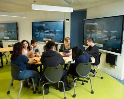 Students in an active learning classroom at Dawson