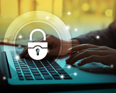 Cyber security concept. Illustration of lock and woman working with laptop at table, closeup