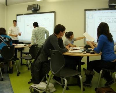 The layout of an active learning classroom is designed to facilitate discussions in small groups, collaboration and face-to-face support.